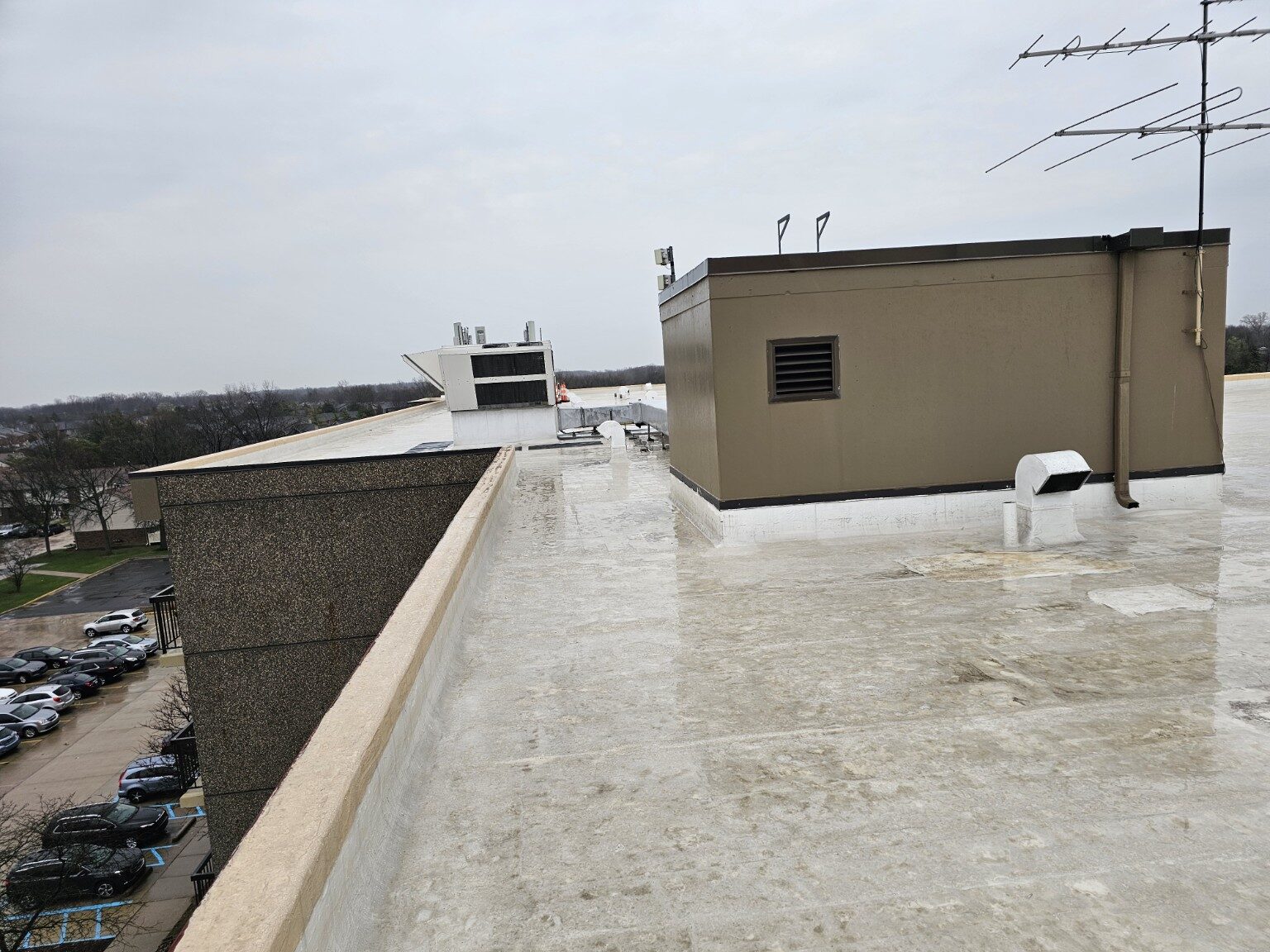 Commercial flat roof installation around rooftop structures and vents
