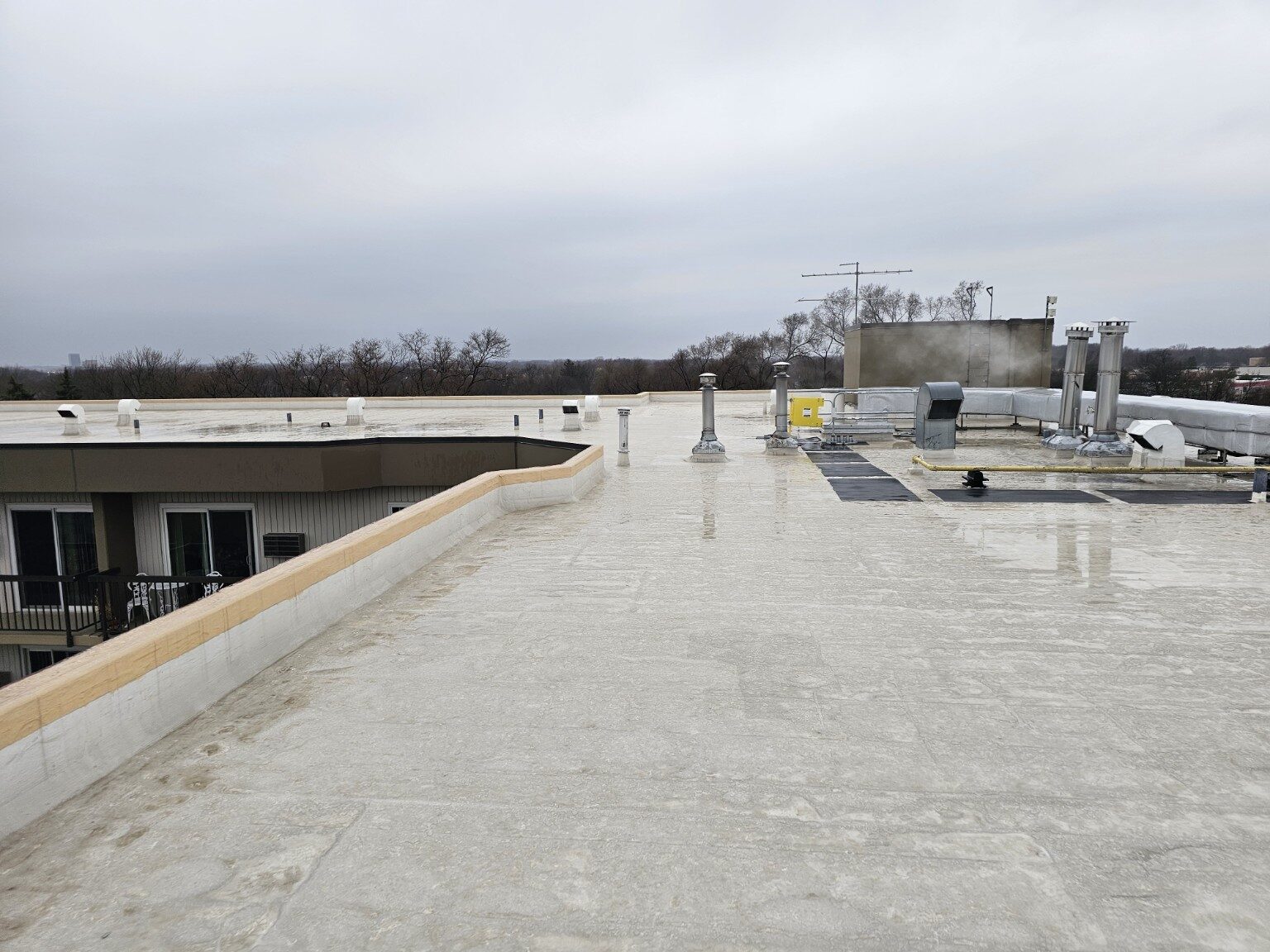 Completed commercial flat roof across a large multi-building property