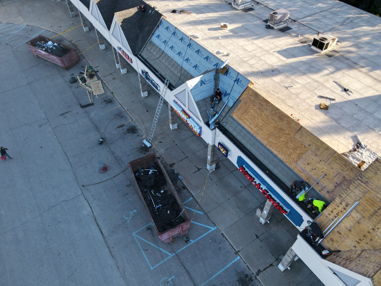 Aerial view of a large commercial roofing project in progress