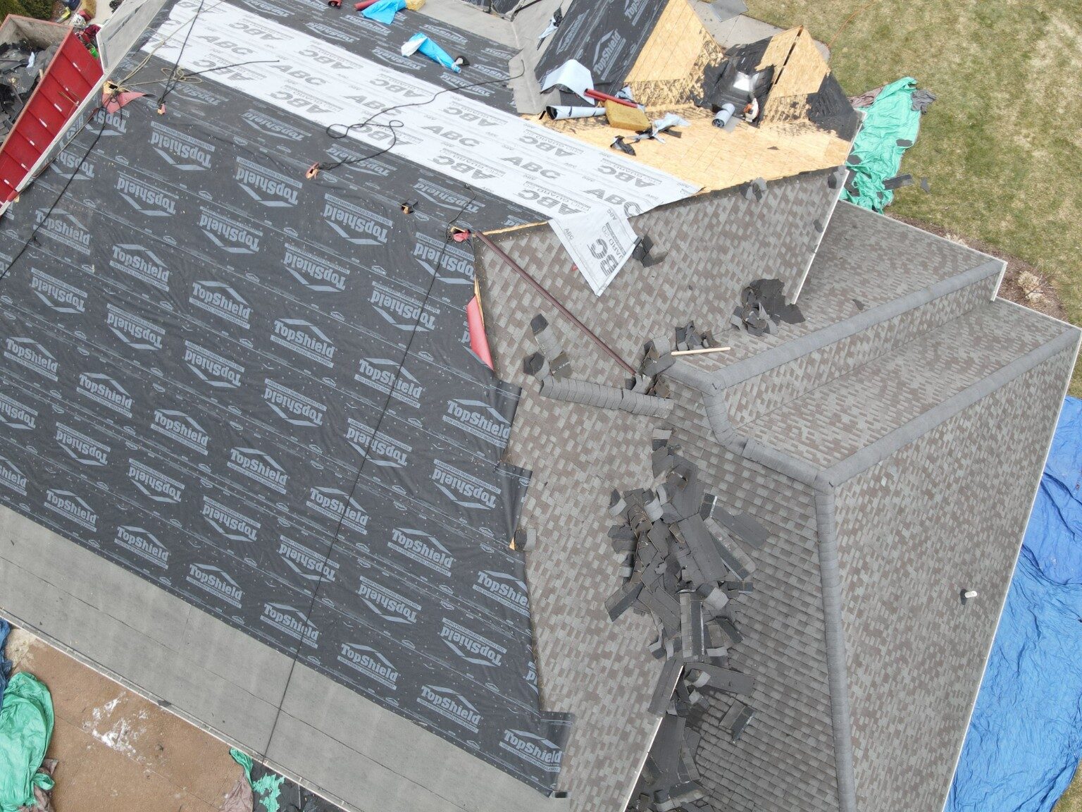 Aerial view of roof replacement work around valleys and dormers