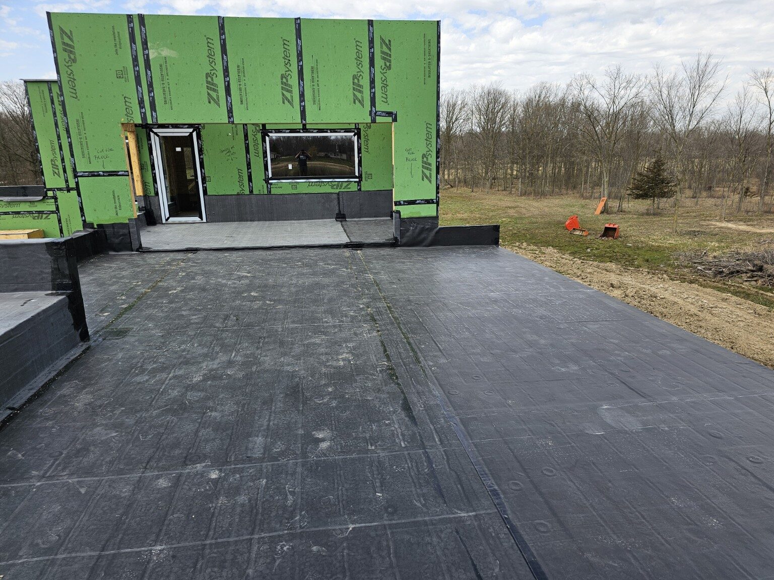 EPDM installation adjoining new construction walls