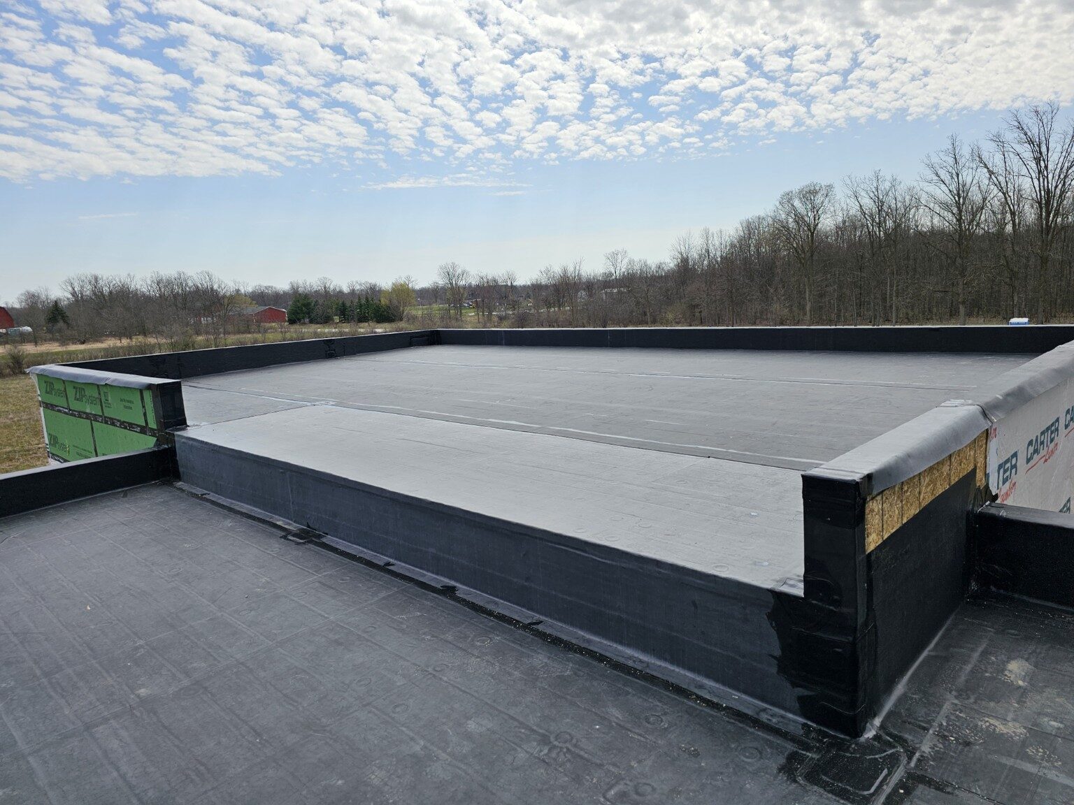 EPDM membrane and raised roof transition detail