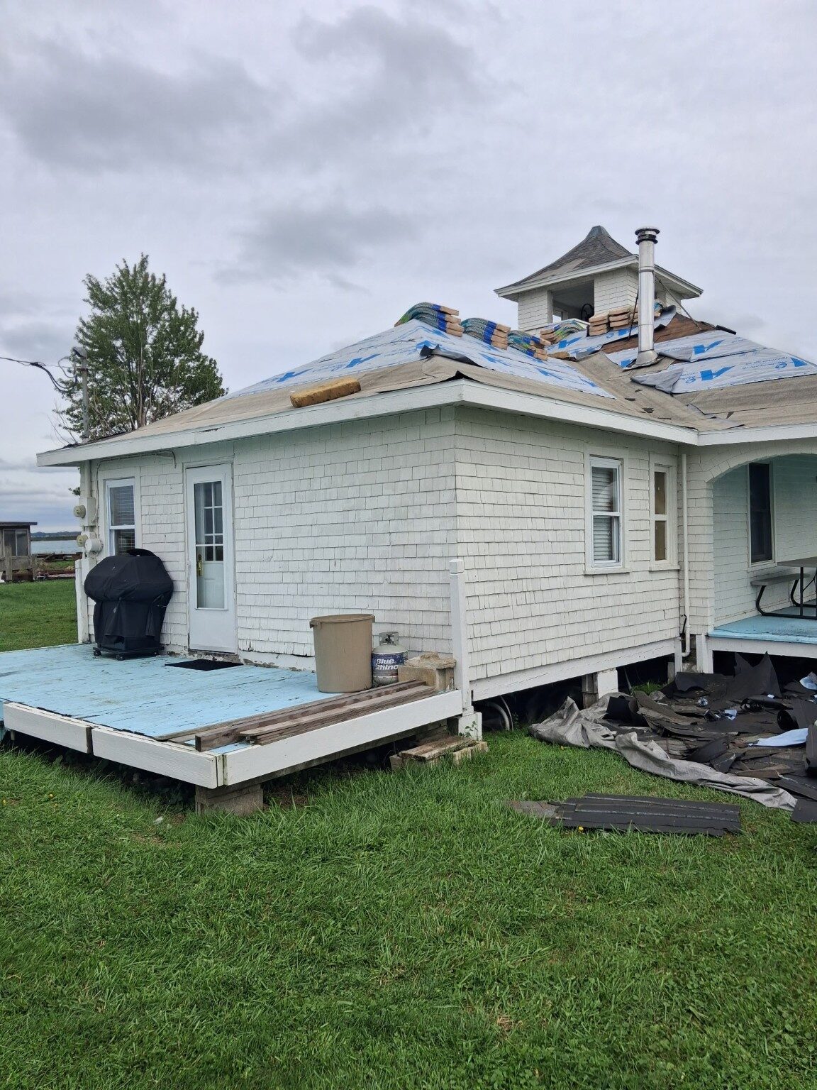 Pavilion roof prepared for new shingles during replacement
