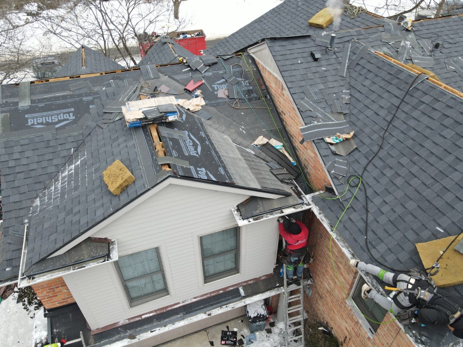 Roof replacement in progress on a Michigan home