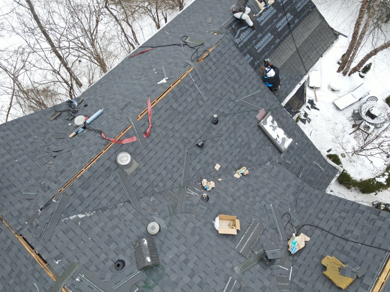 Aerial view of a large roof installation in progress