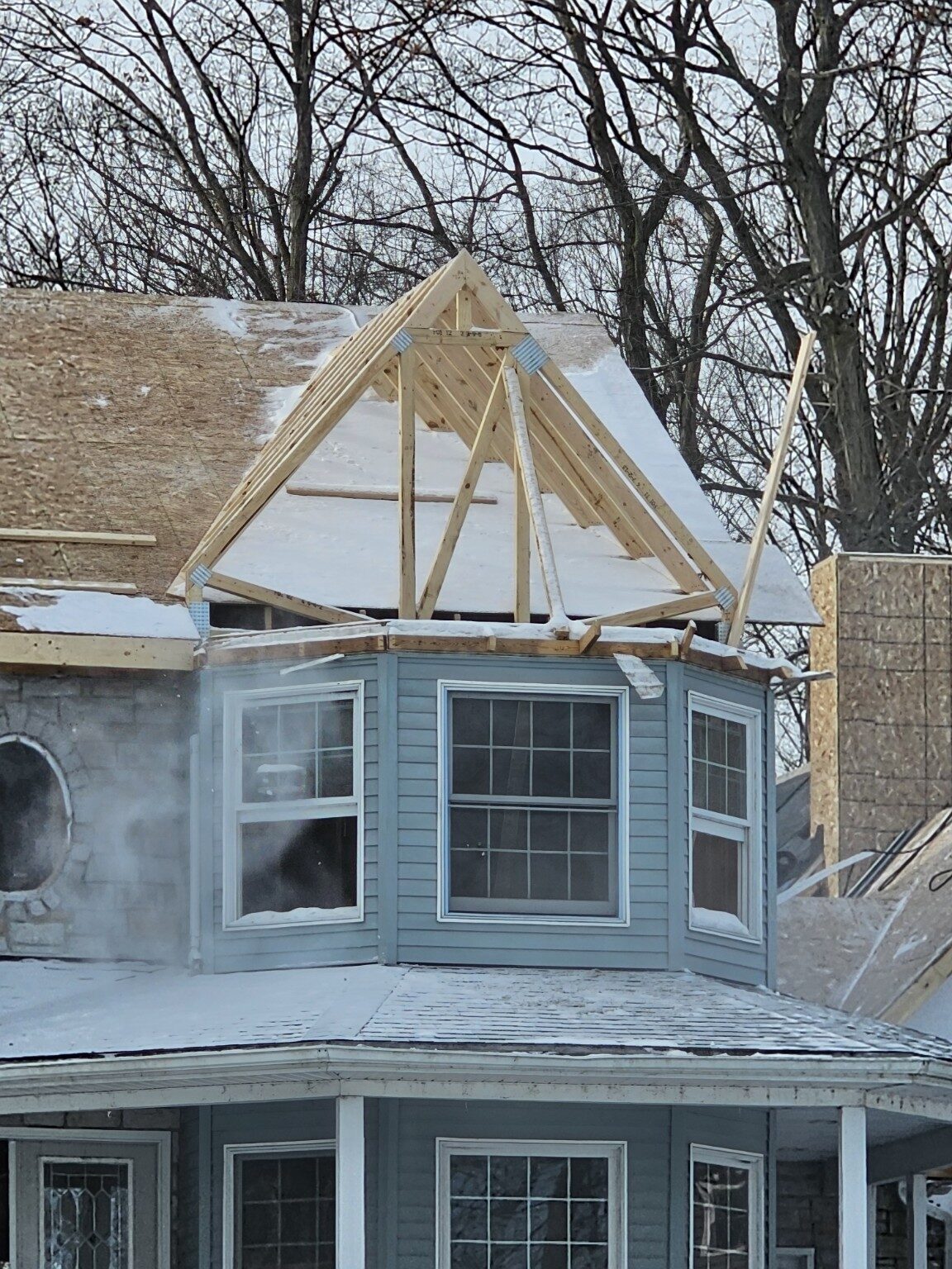 Detailed exterior renovation around a home dormer